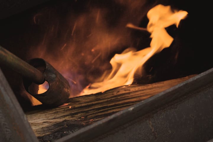 Flame climbing off the coals