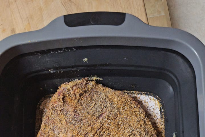 Rubbed meat resting in a tub